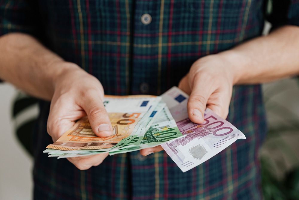 Man counting his last savings due to unemployment during the Covid-19 pandemic