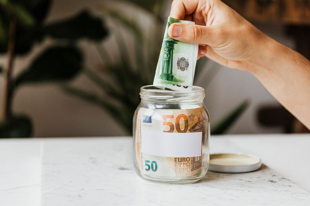 Saving money in a jar during the COVID-19 pandemic