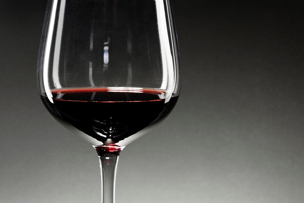 Wine glass filled with red wine closeup