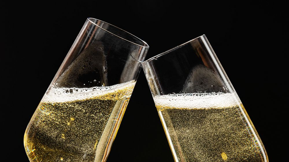 Two festive champagne glasses celebration