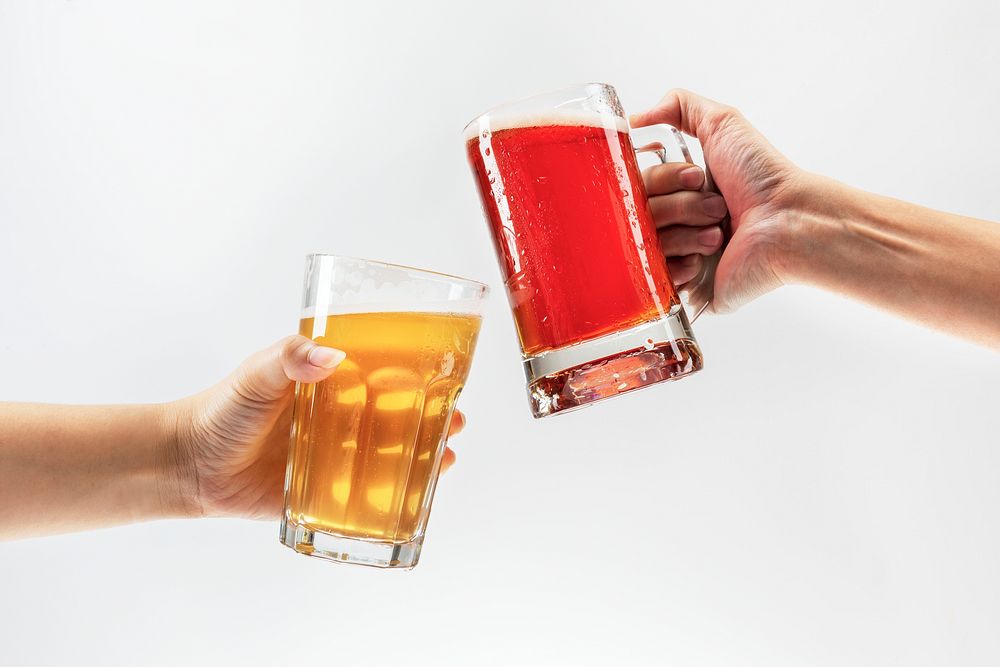 Men toasting with beer on white background
