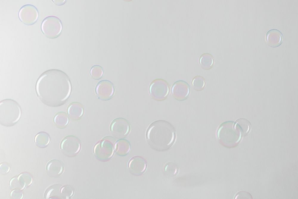 Transparent soap bubble pattern on a gray background wallpaper