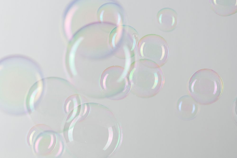 Transparent soap bubble pattern on a gray wallpaper background