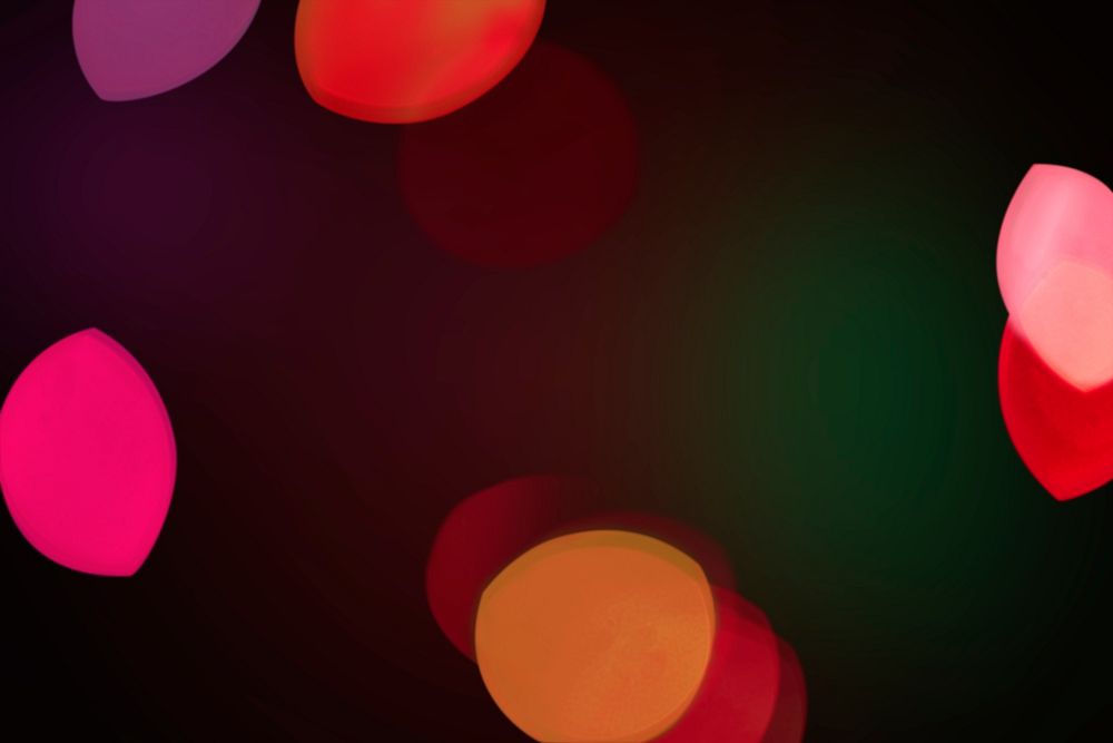 Red bokeh pattern design element on a dark background