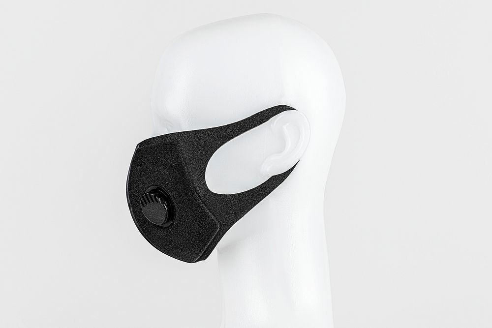 Black foam mask with valve on white mannequin head 