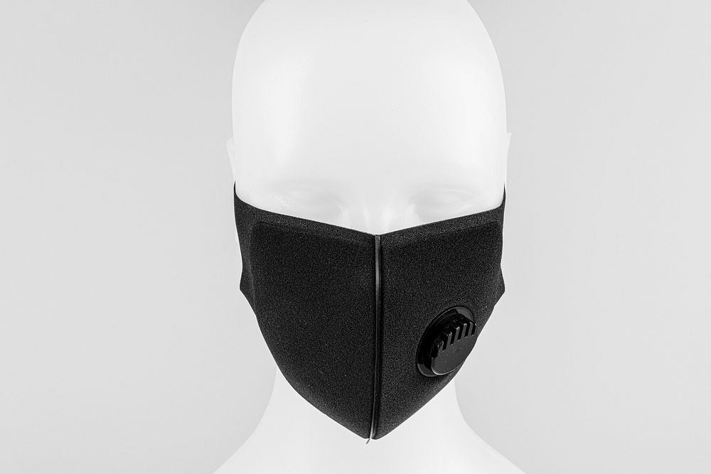 Black foam mask with valve on white mannequin head 
