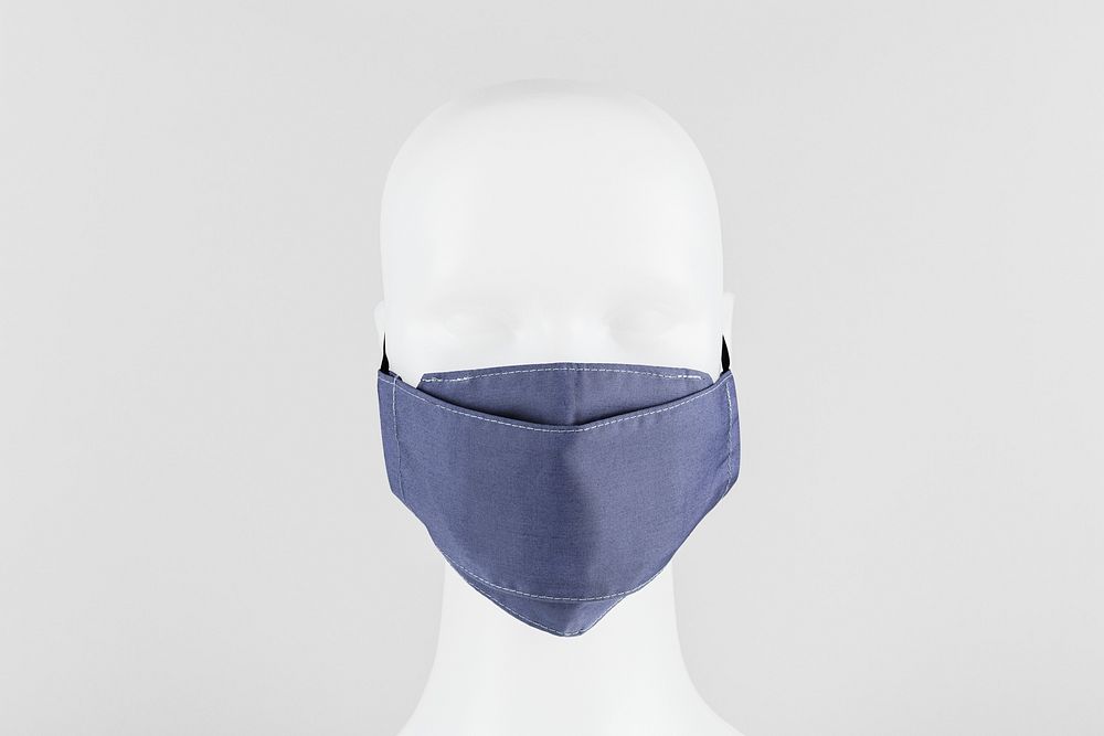 Light purplish-blue fabric face mask on a dummy head