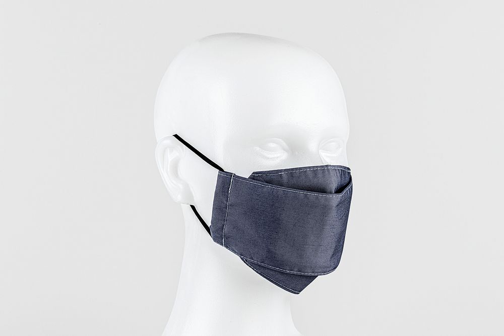 Light purplish-blue fabric face mask on a dummy head