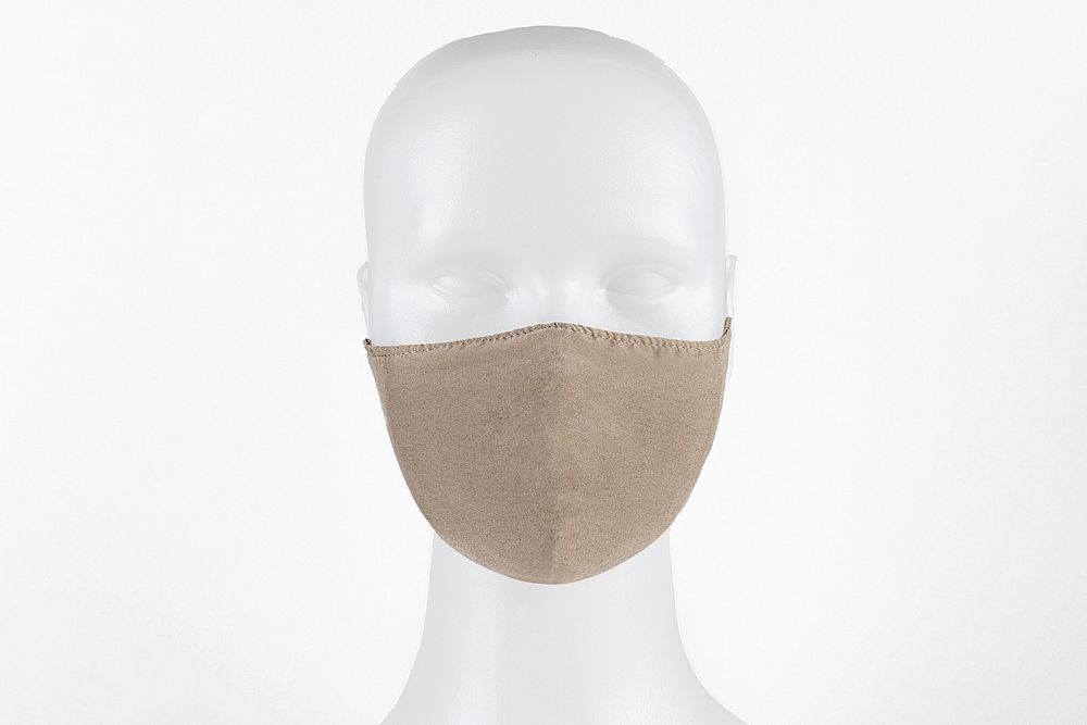 Beige fabric face mask on a dummy head