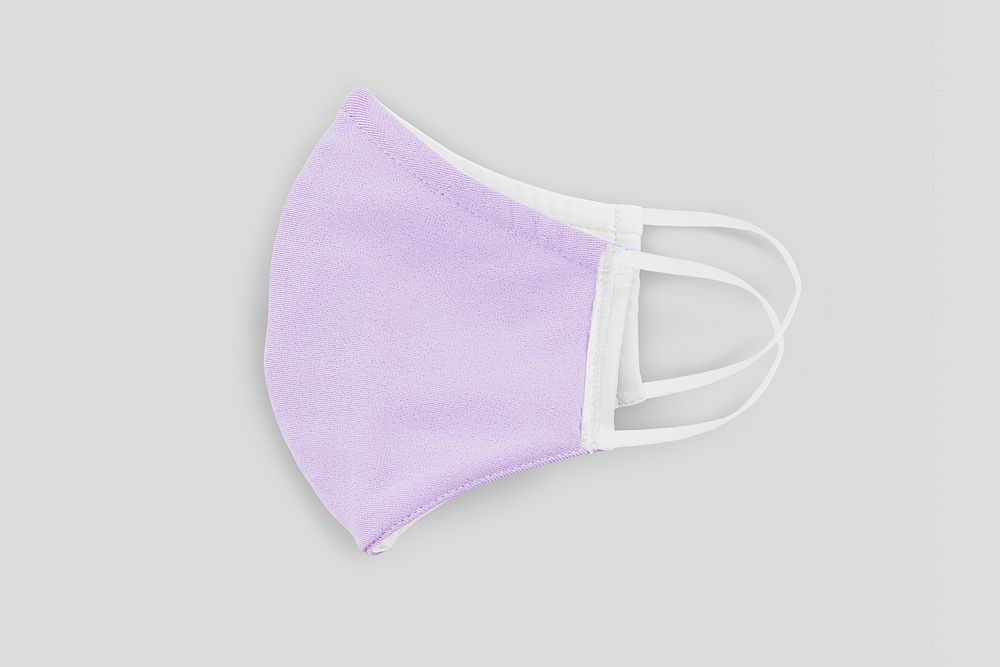 Pastel purple fabric face mask on a gray background