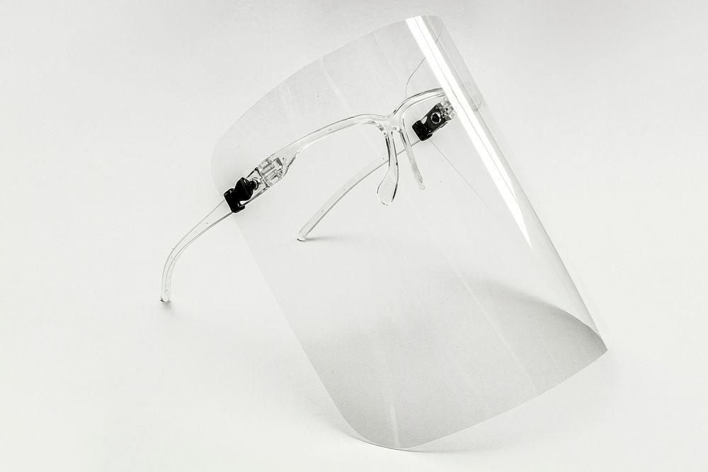 Eyewear with detachable face shield on a white background