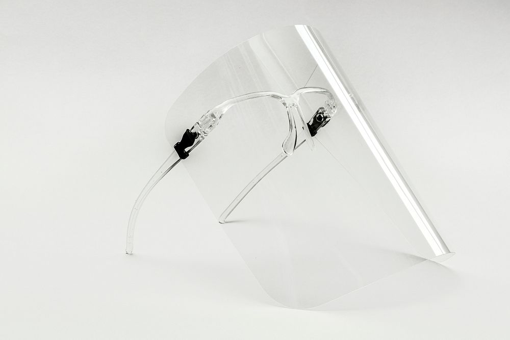 Eyewear with detachable face shield on a white background