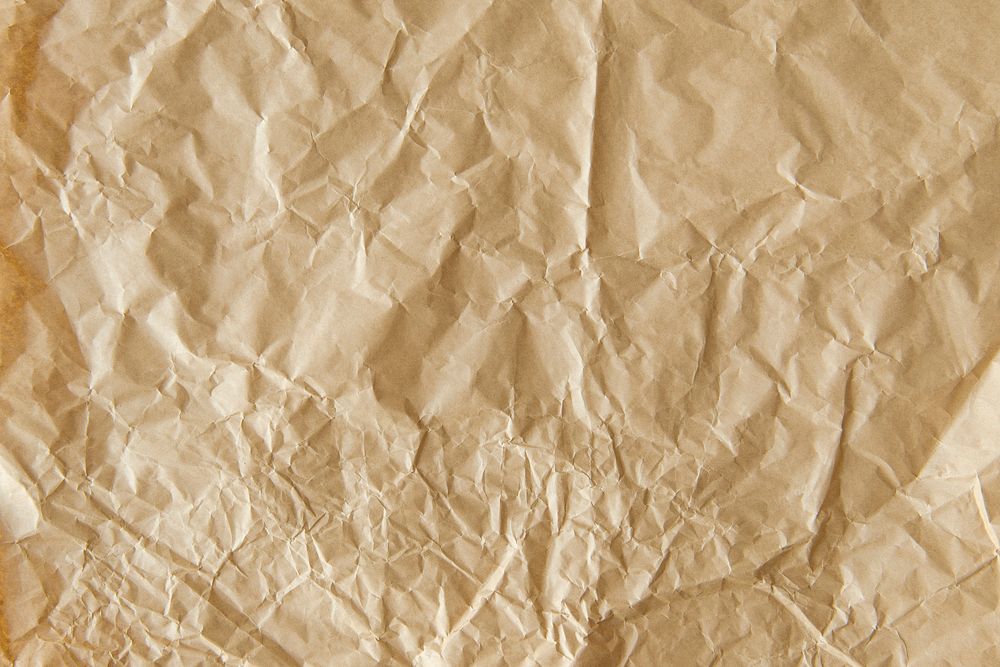 Crumpled brown paper textured background