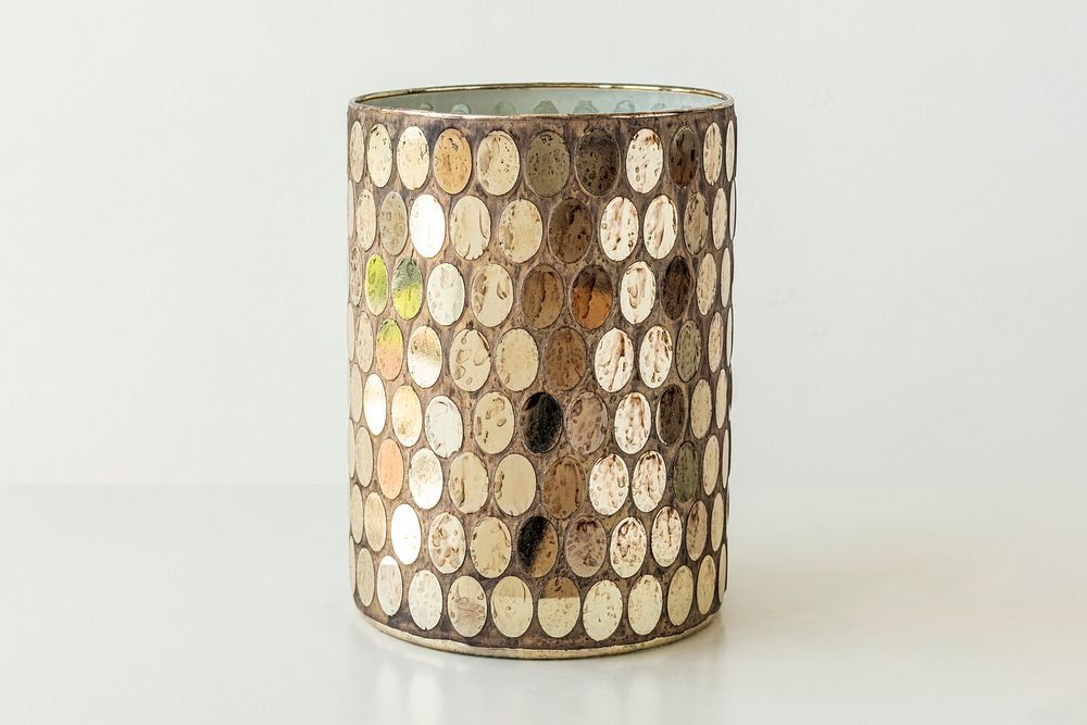 Mosaic glass candle holder on off white background