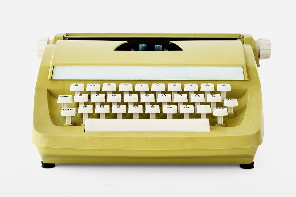 Retro pastel yellow typewriter on off white background