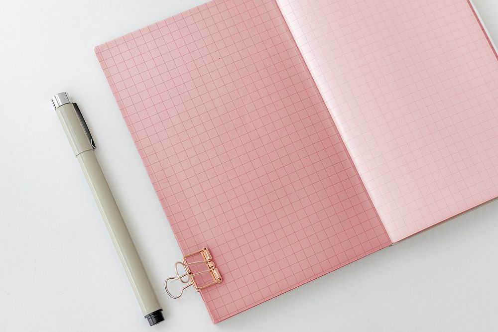 Blank plain pink notebook page with stationary mockup