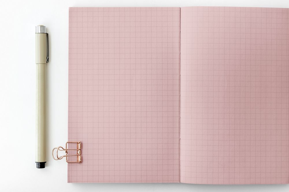 Pink grid patterned notebook page with stationary mockup
