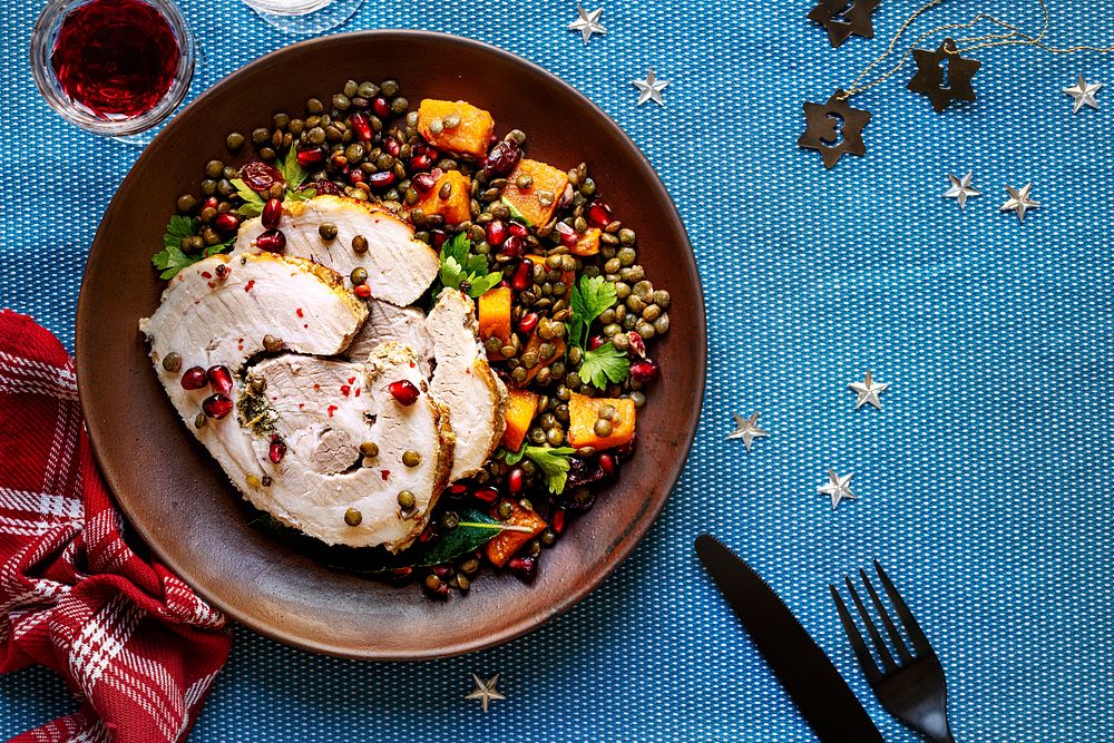 Roasted Christmas ham with pomegranate and lentils food photography