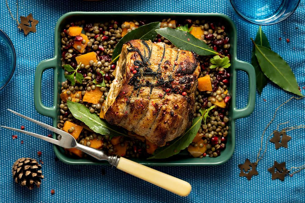 Roasted Christmas ham with pomegranate and lentils food photography