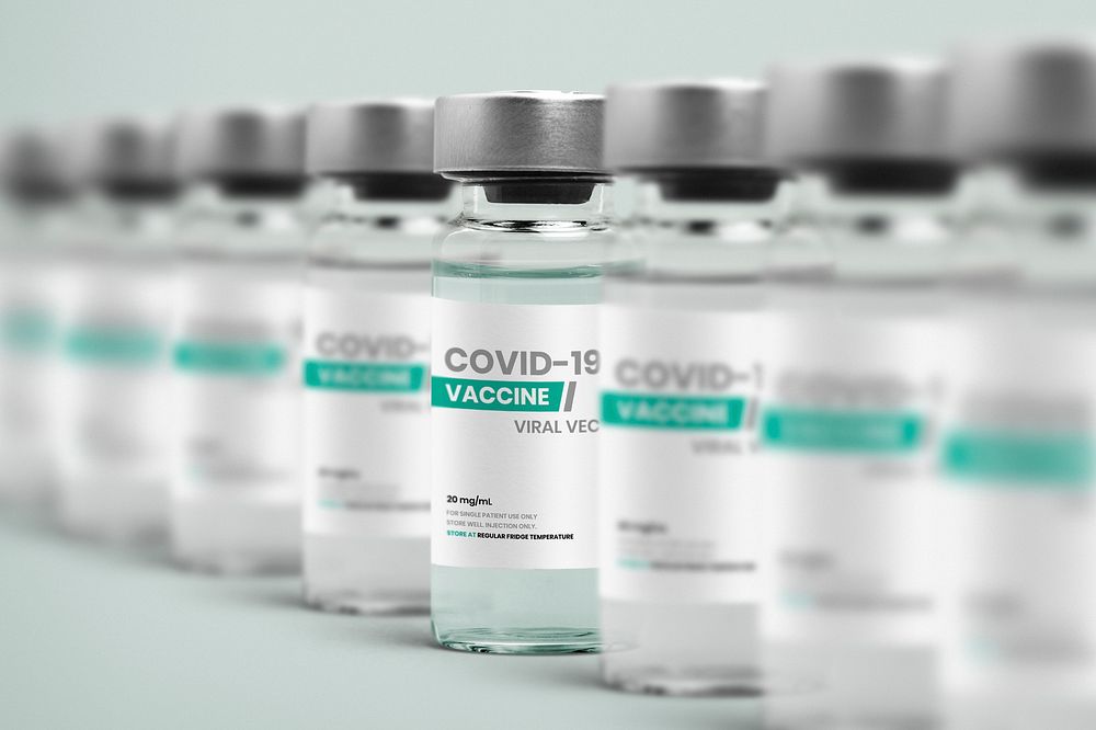 COVID-19 vaccine injection glass bottles in a row