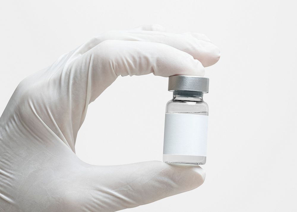 Medicine vial with label mockup psd in doctor's hand