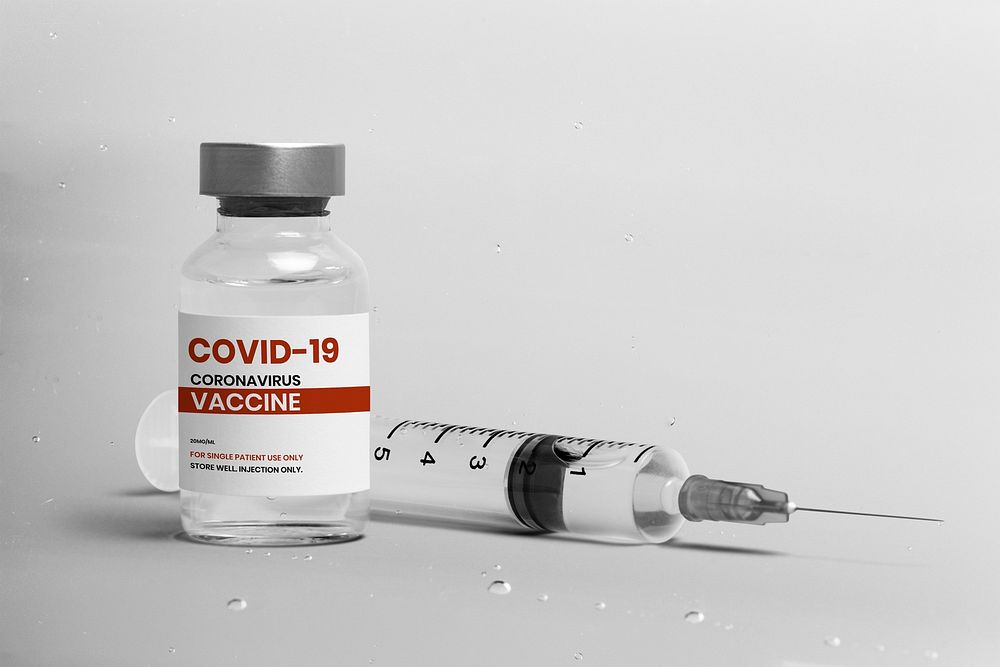 COVID-19 vaccine bottle/label mockup with syringe psd