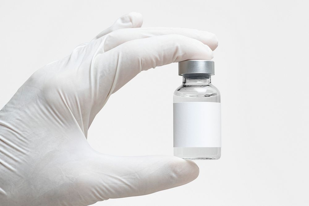 Injection bottle with label mockup psd in nurse's  hand