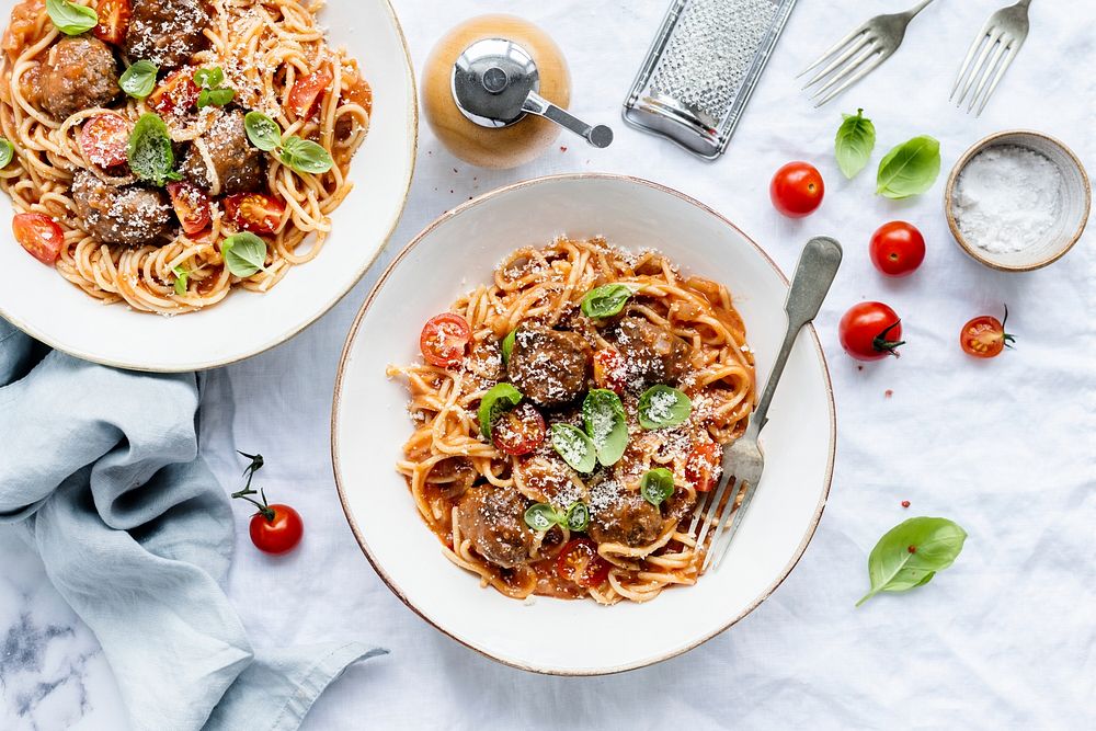 Spaghetti meatball topped with parmesan and basil food photography