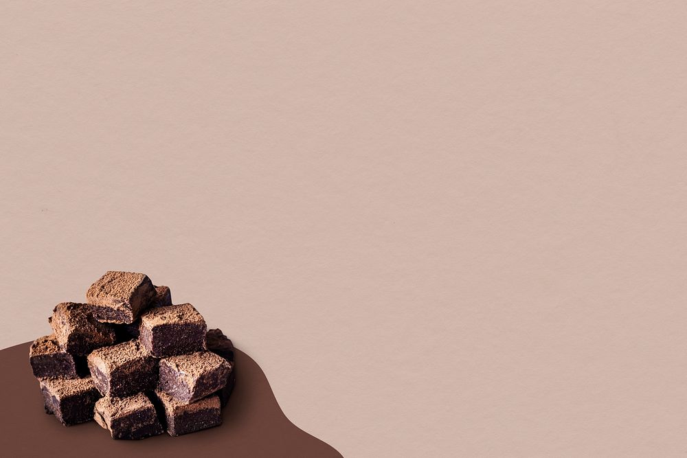 Chocolate ganache truffle squares dusted with cacao powder psd layer