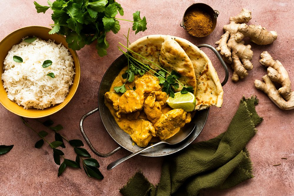 Butter chicken Indian curry in a pan food photography