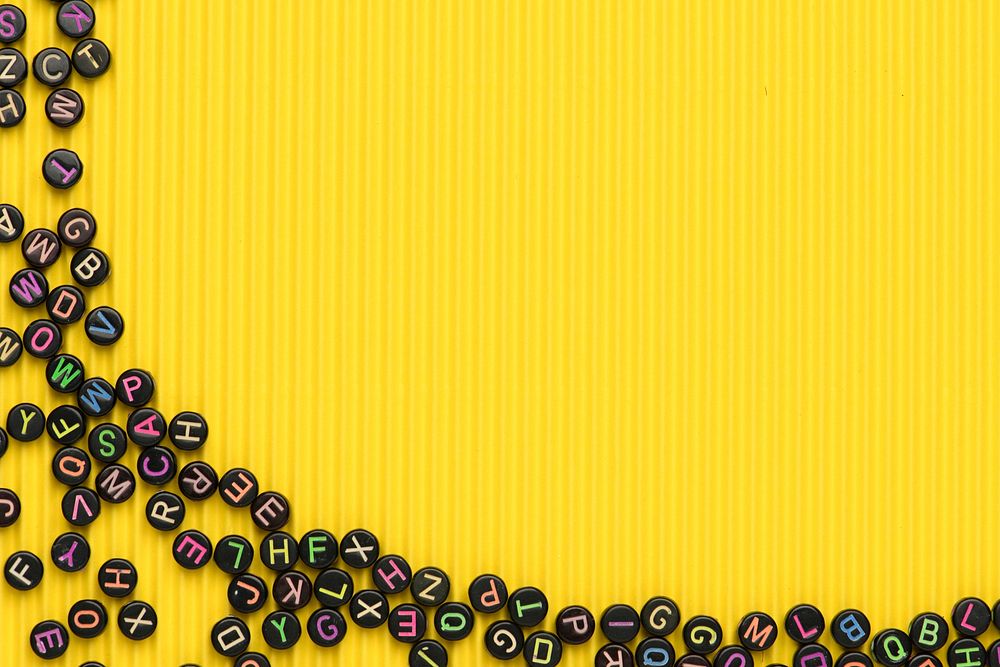 Black letter beads border yellow | Free Photo - rawpixel