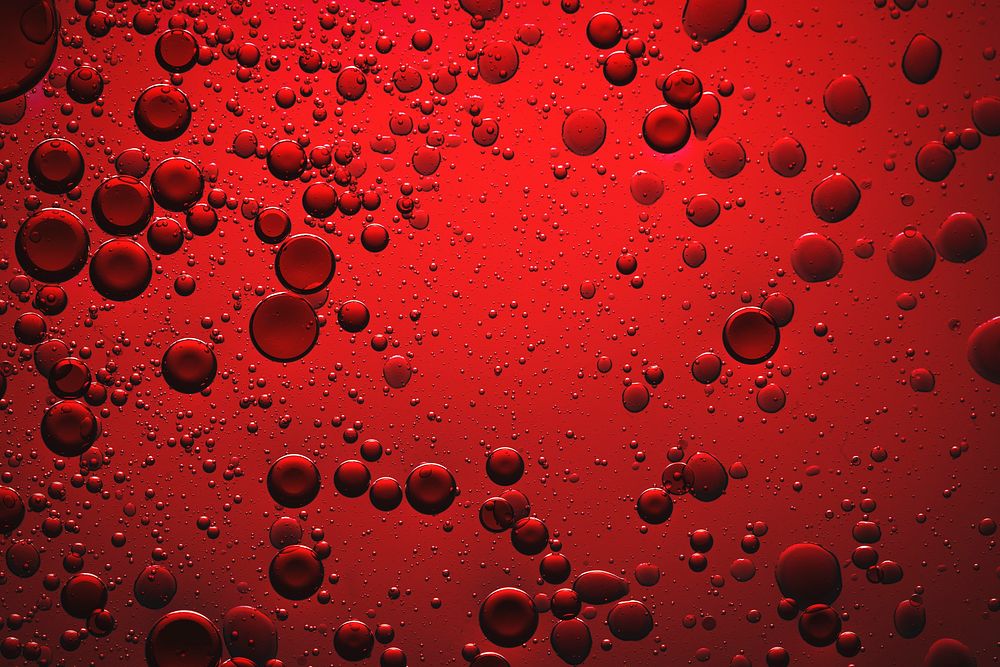 Red background oil bubble in water