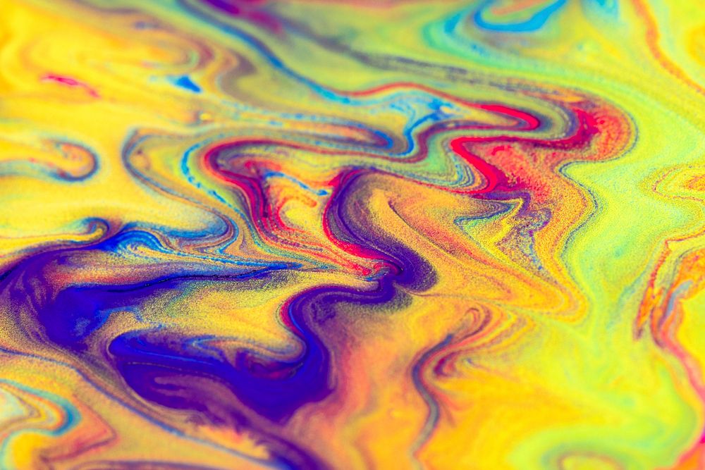 Yellow liquid marble background handmade colorful flowing texture experimental art