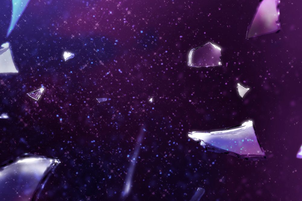 Pieces of broken shattered glass background in purple light