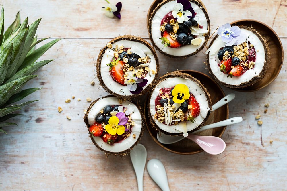 Flat lay fruits and grains in coconut shell tropical vibes 