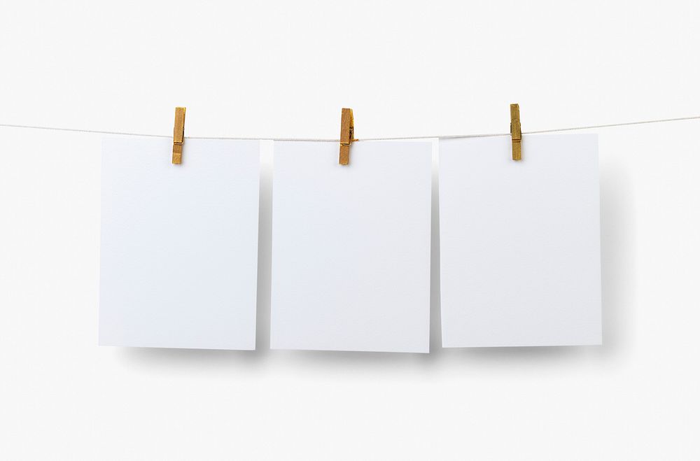 Blank photos hanging by wooden clip