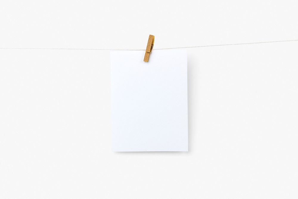 Blank photos hanging by wooden clip