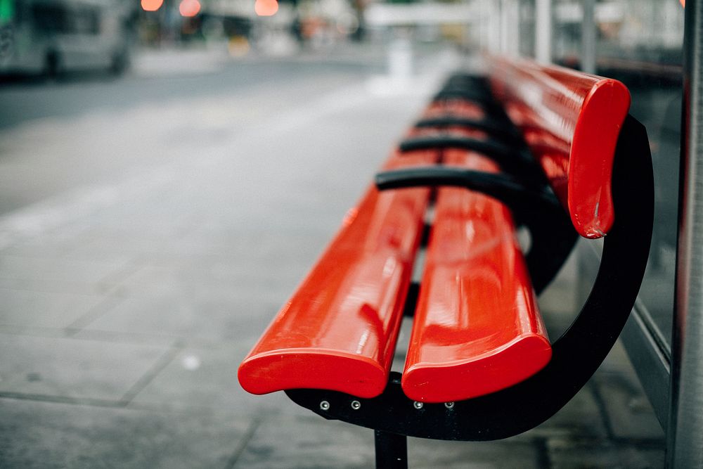 Empty red bench in the city