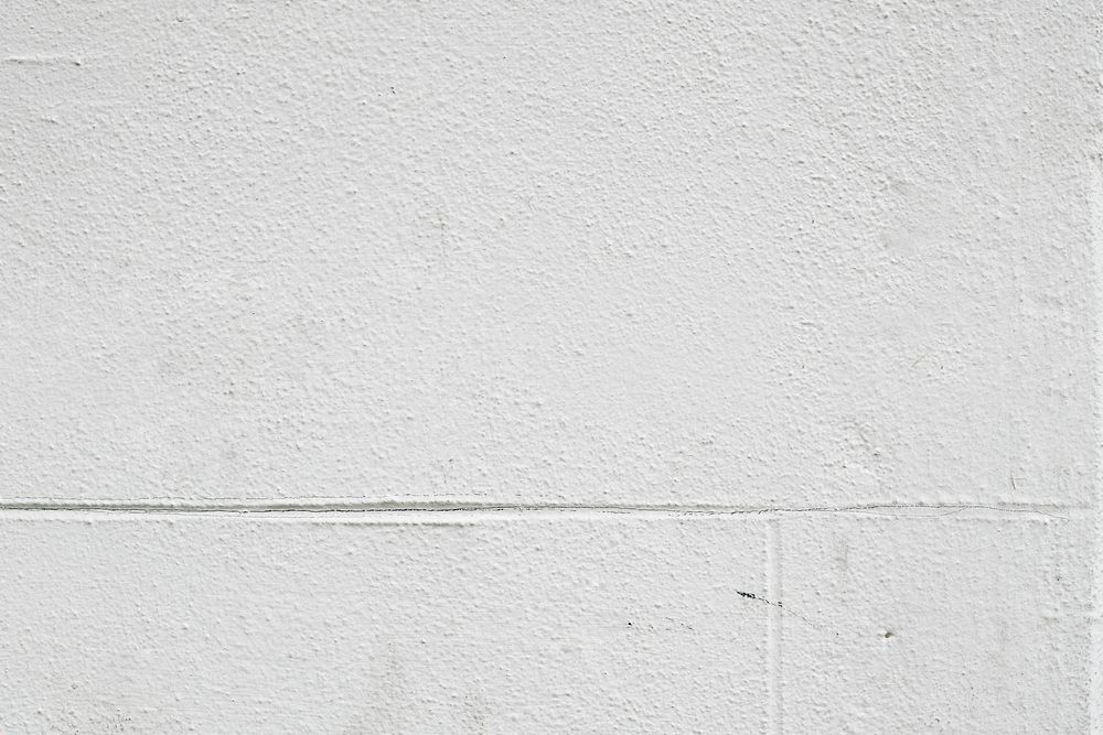 White rough stuccoed wall background