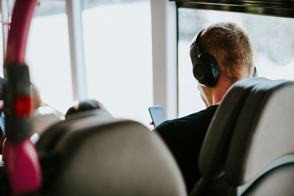 Man listening to a music on a bus