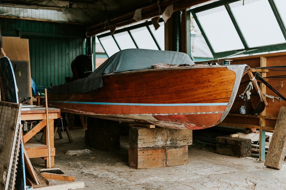 Old wooden boat in a garage