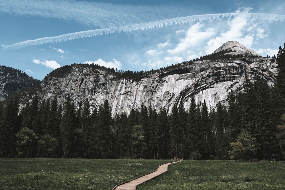 Contrails over the blue sky in Yosemite National Park, California