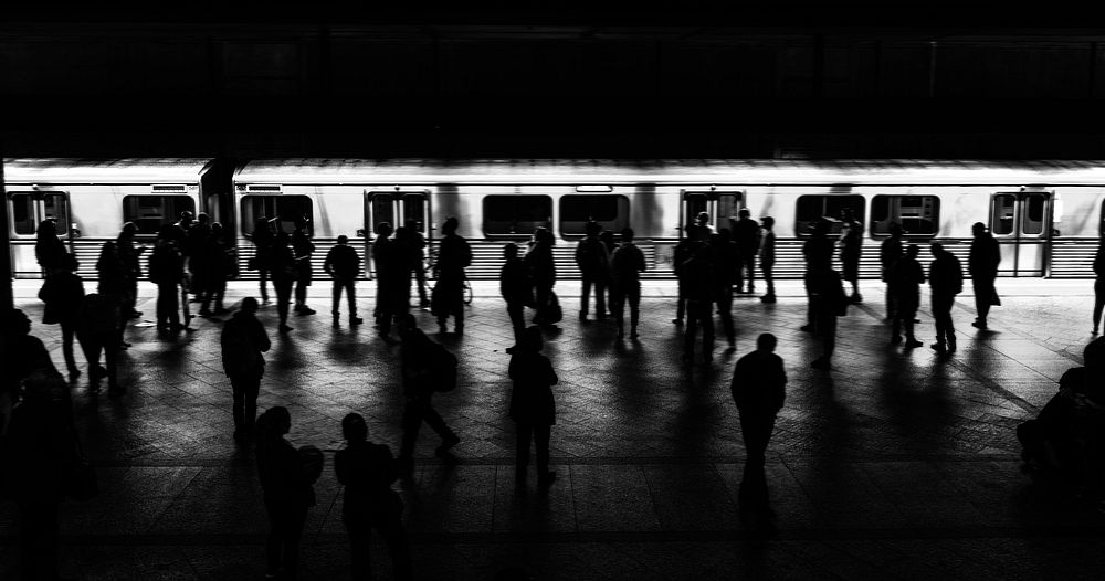 People waiting for a train on a platform