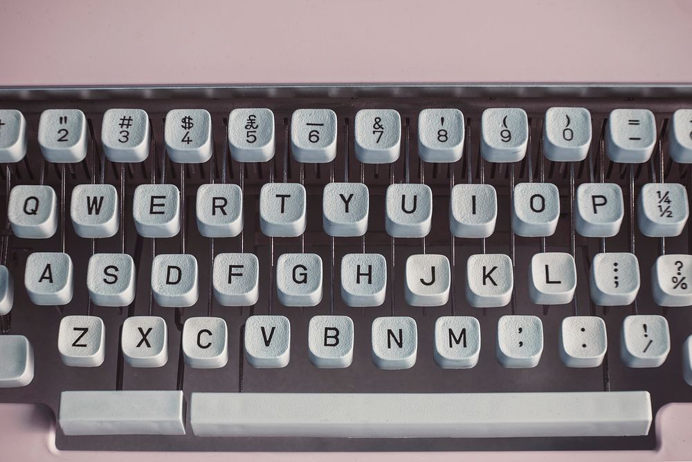 Closeup of a retro pastel pink typewriter