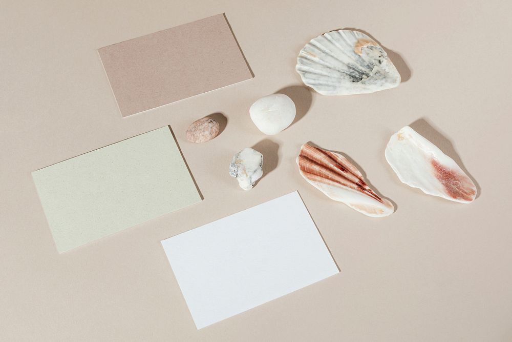 Blank business cards decorated with stones and seashells
