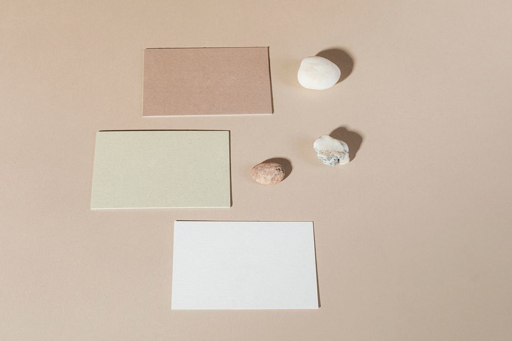 Blank business cards on beige background