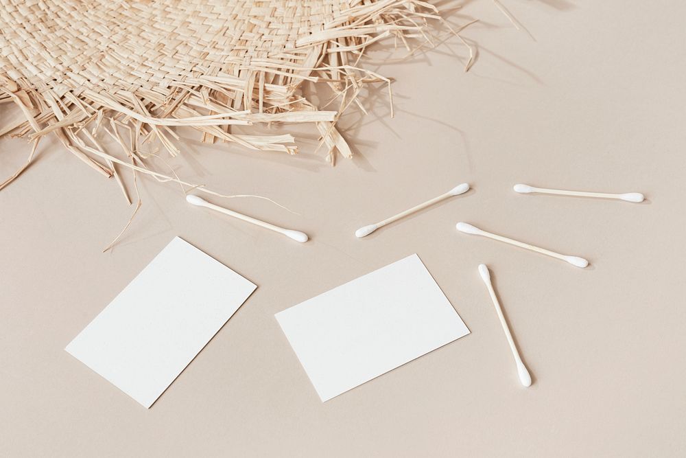 Blank business cards with cotton buds and woven mat