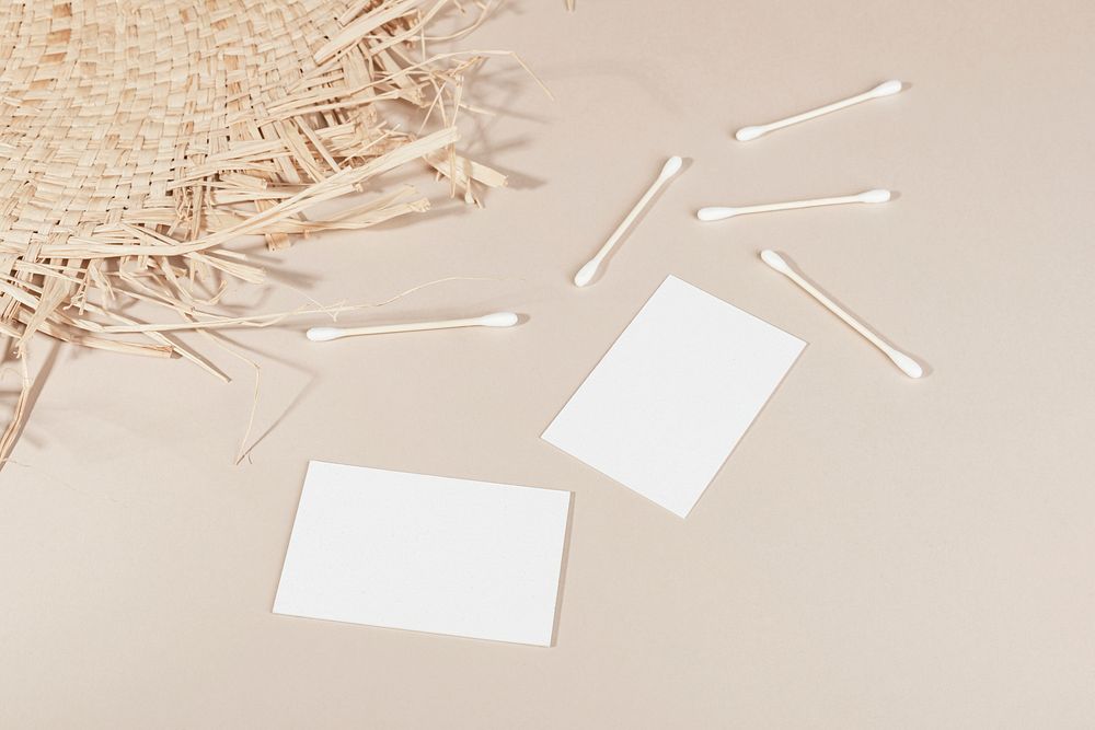 Blank business cards with cotton buds and woven mat