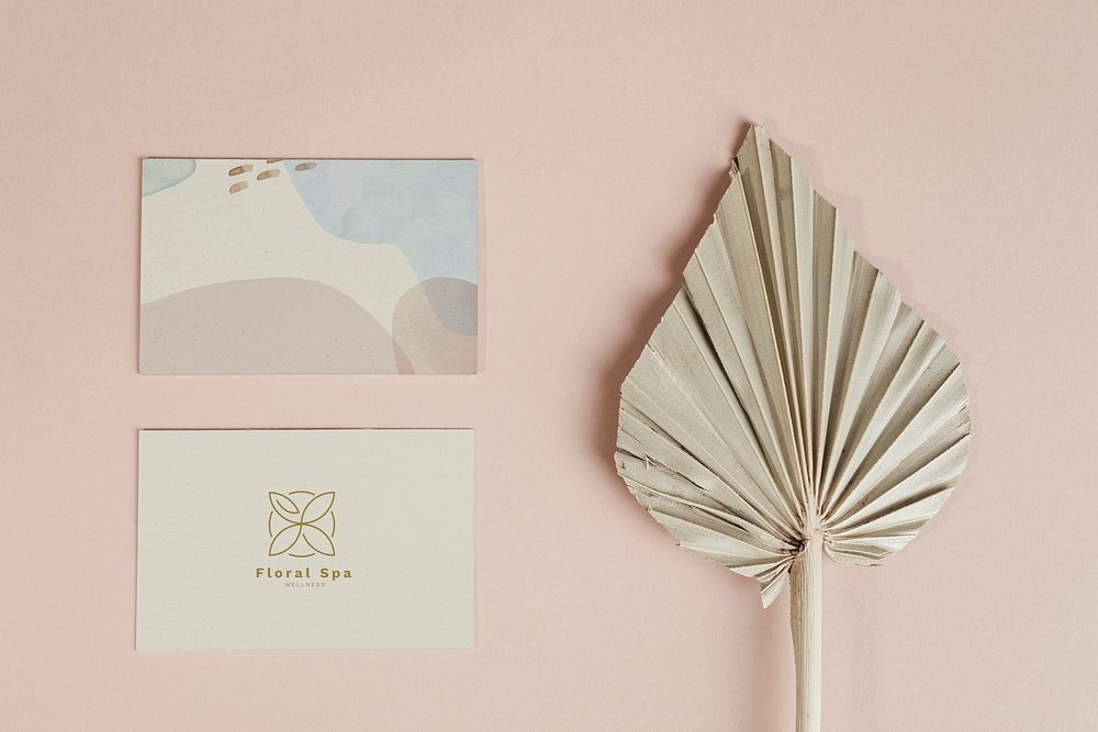 Business cards with dried palm leaf mockup