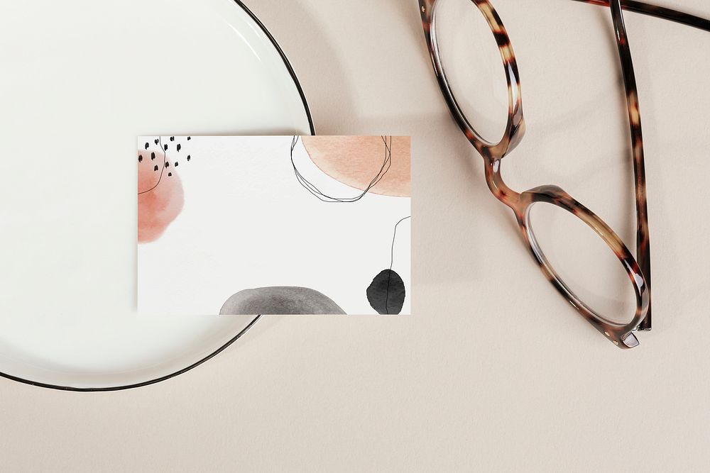 Business card on a plate with glasses